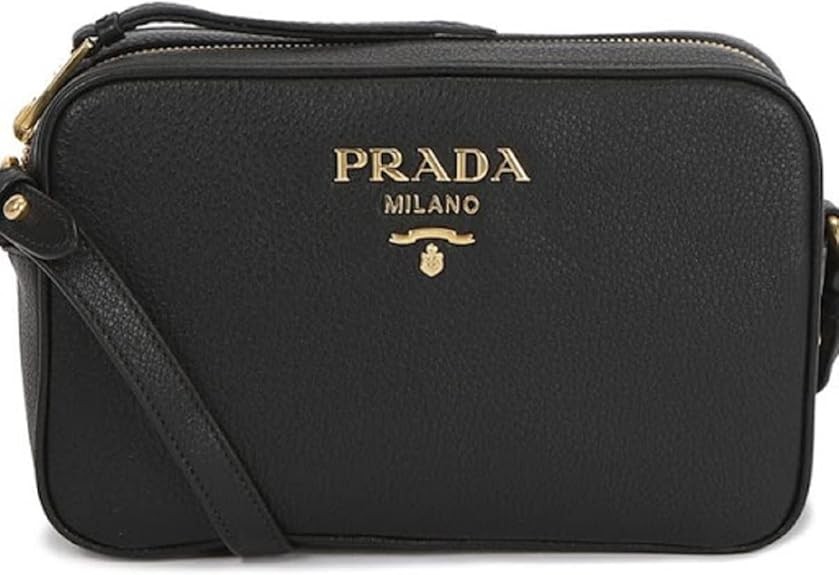 Prada Vitello Phenix Black Leather Camera Crossbody Bag Gold-Tone Hardware Adjustable Strap Top Zip Closure Interior Zip & Slip Pockets 8.5" x 2.5" x 5.5" Made in Italy New